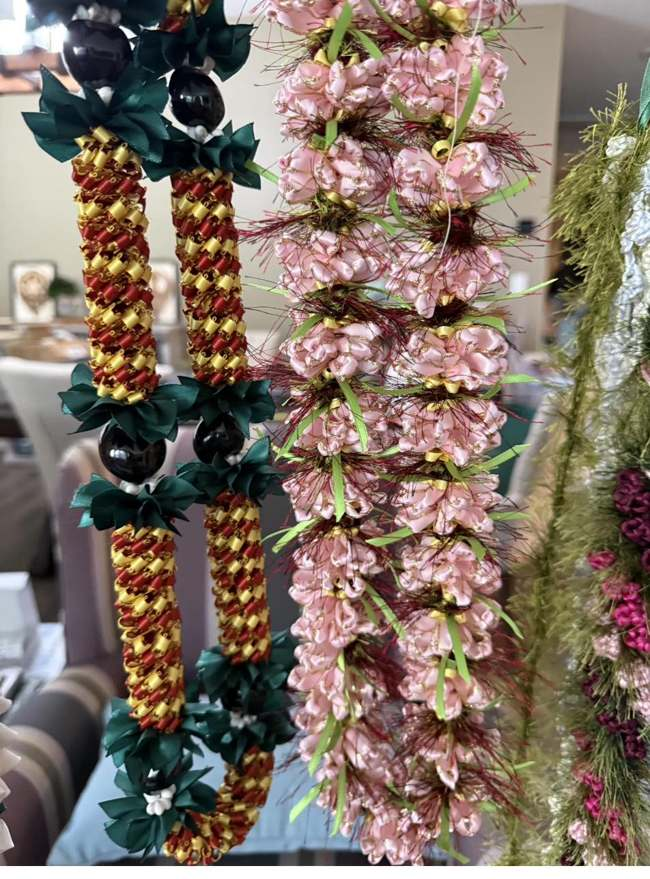 Deep red and green ribbon lei with black kukui-style beads