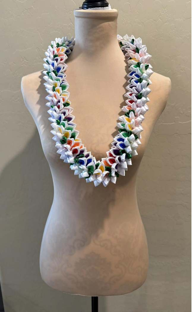 Crochet lei with pink and purple flower clusters on olive base